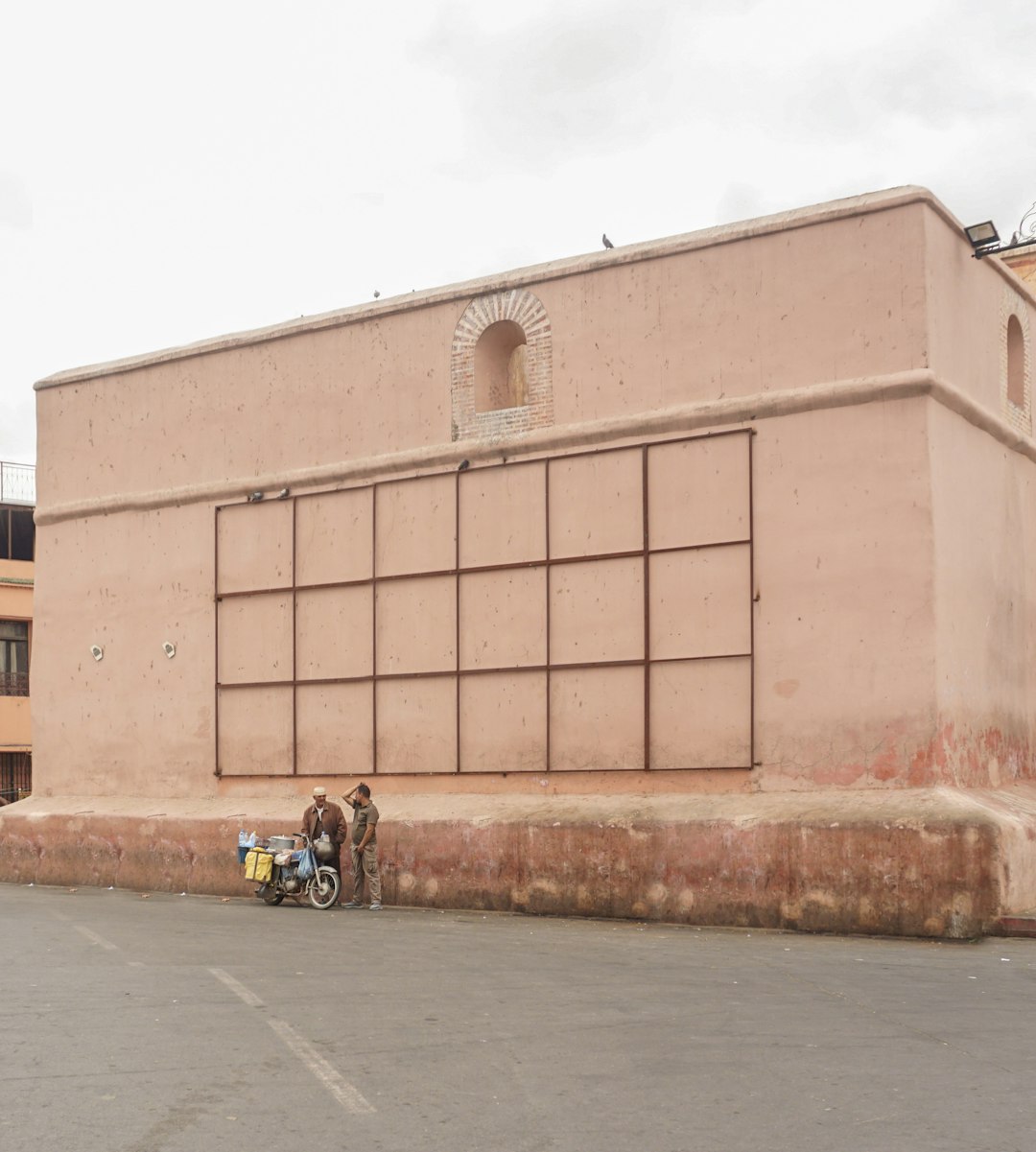 a couple of people standing in front of a building