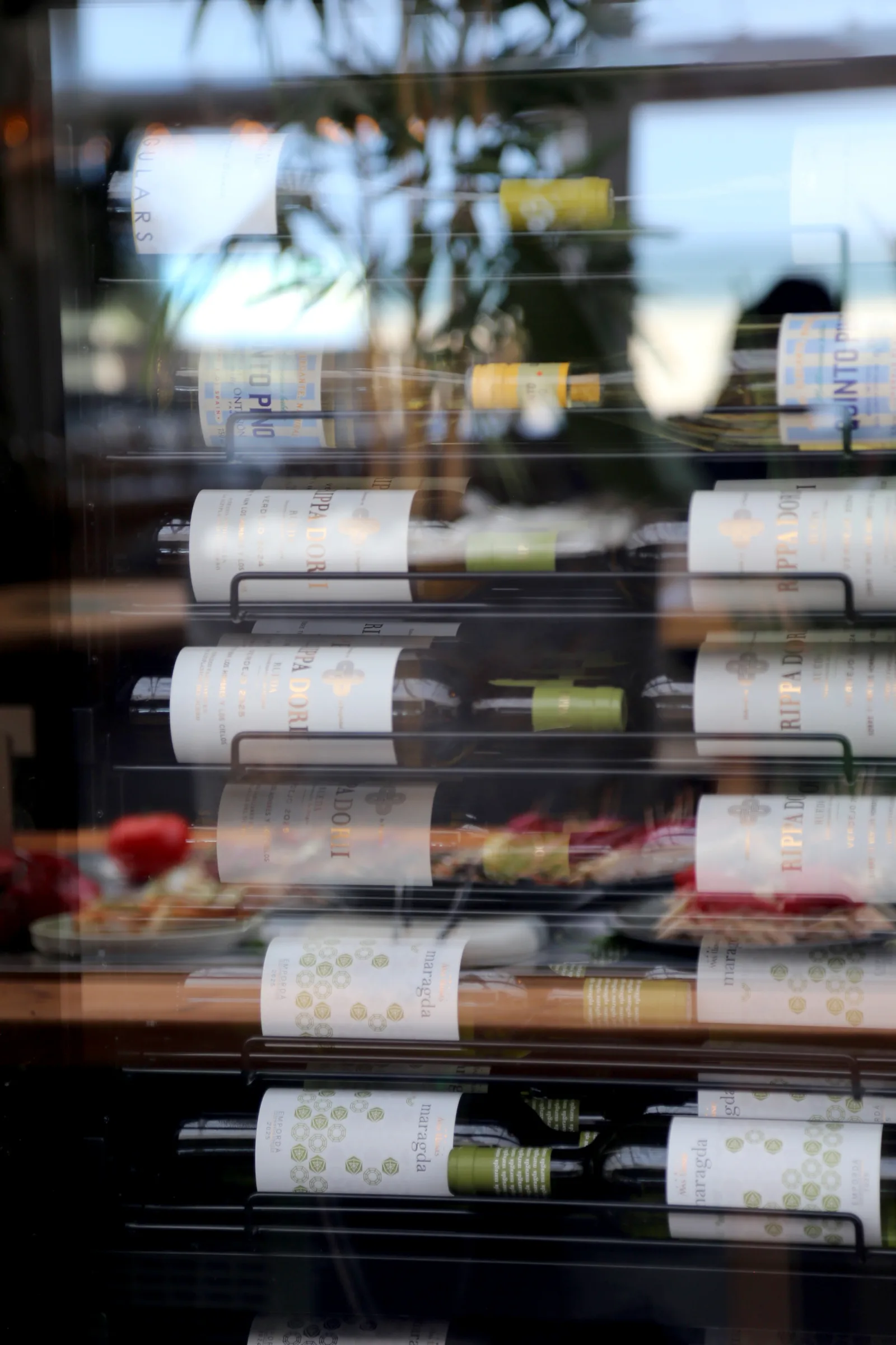 Wine bottles displayed in a restaurant wine rack.