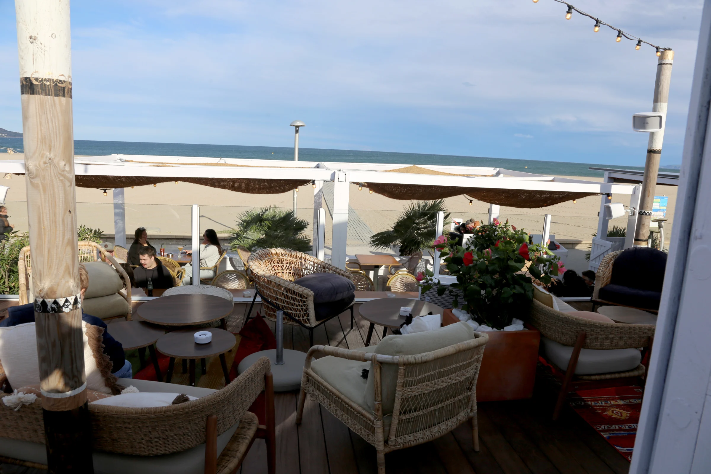 Outdoor seating area at a beachside restaurant
