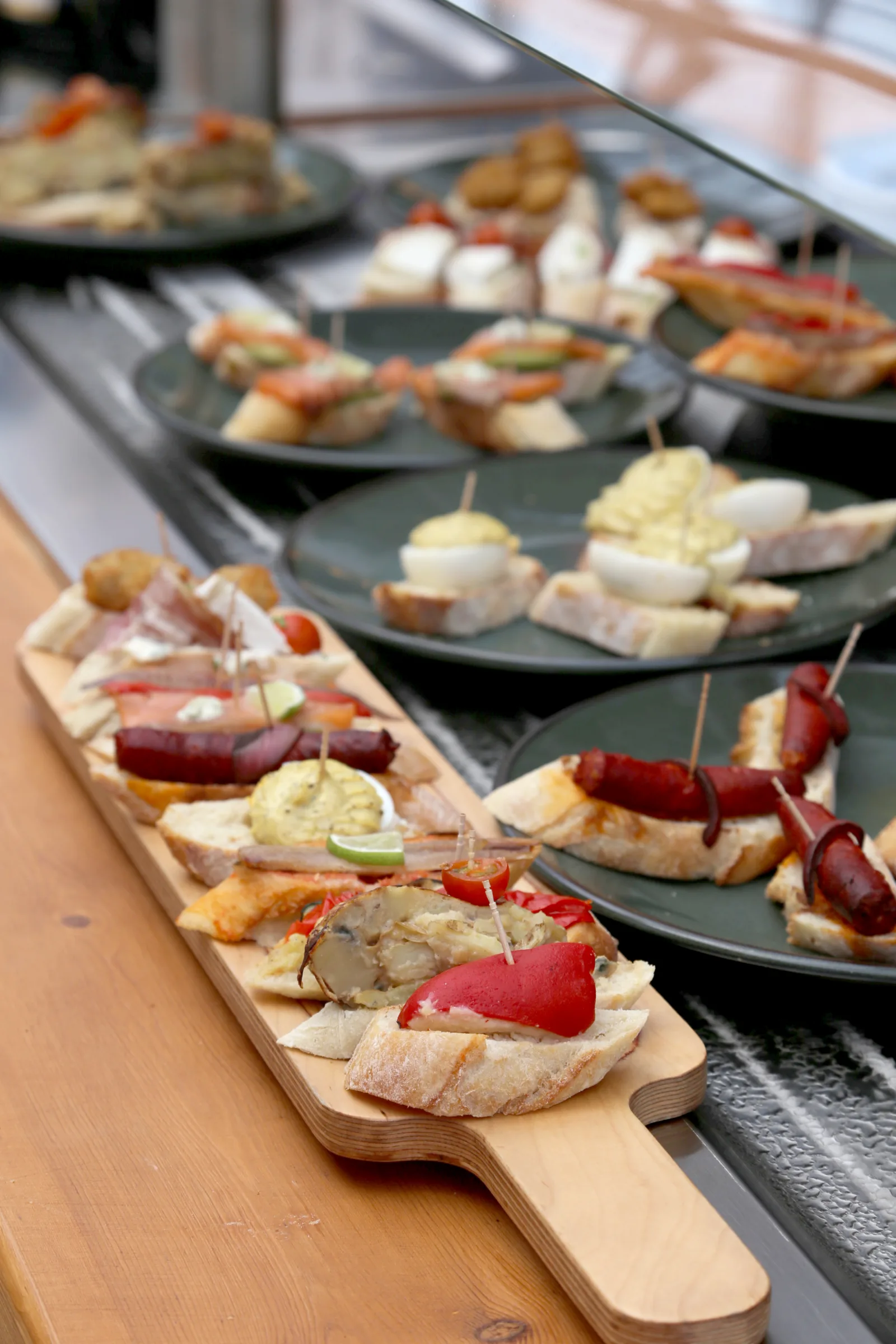 Platter of assorted tapas with various toppings