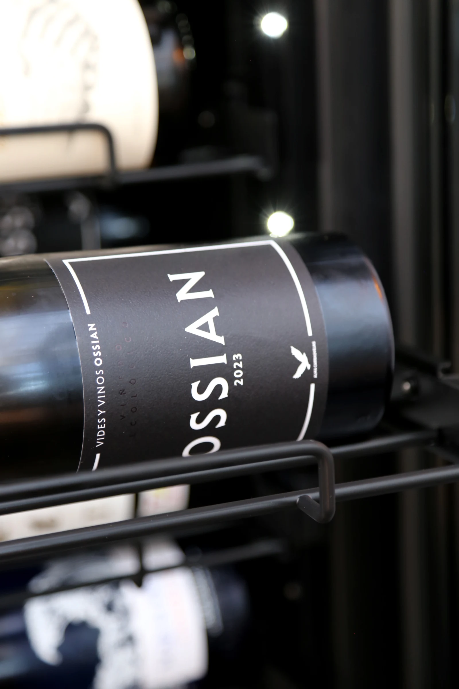 Close-up of a wine bottle labeled Ossian 2023